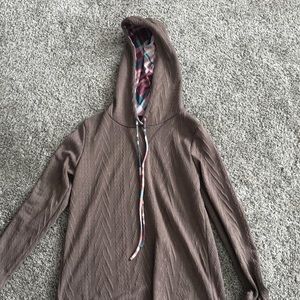 Lavander/pinkish color sweater with cool color design on hood. And elbow pads